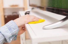 housewife-cleaning-dust-tv-stand-living-room-min-1024x668.jpg